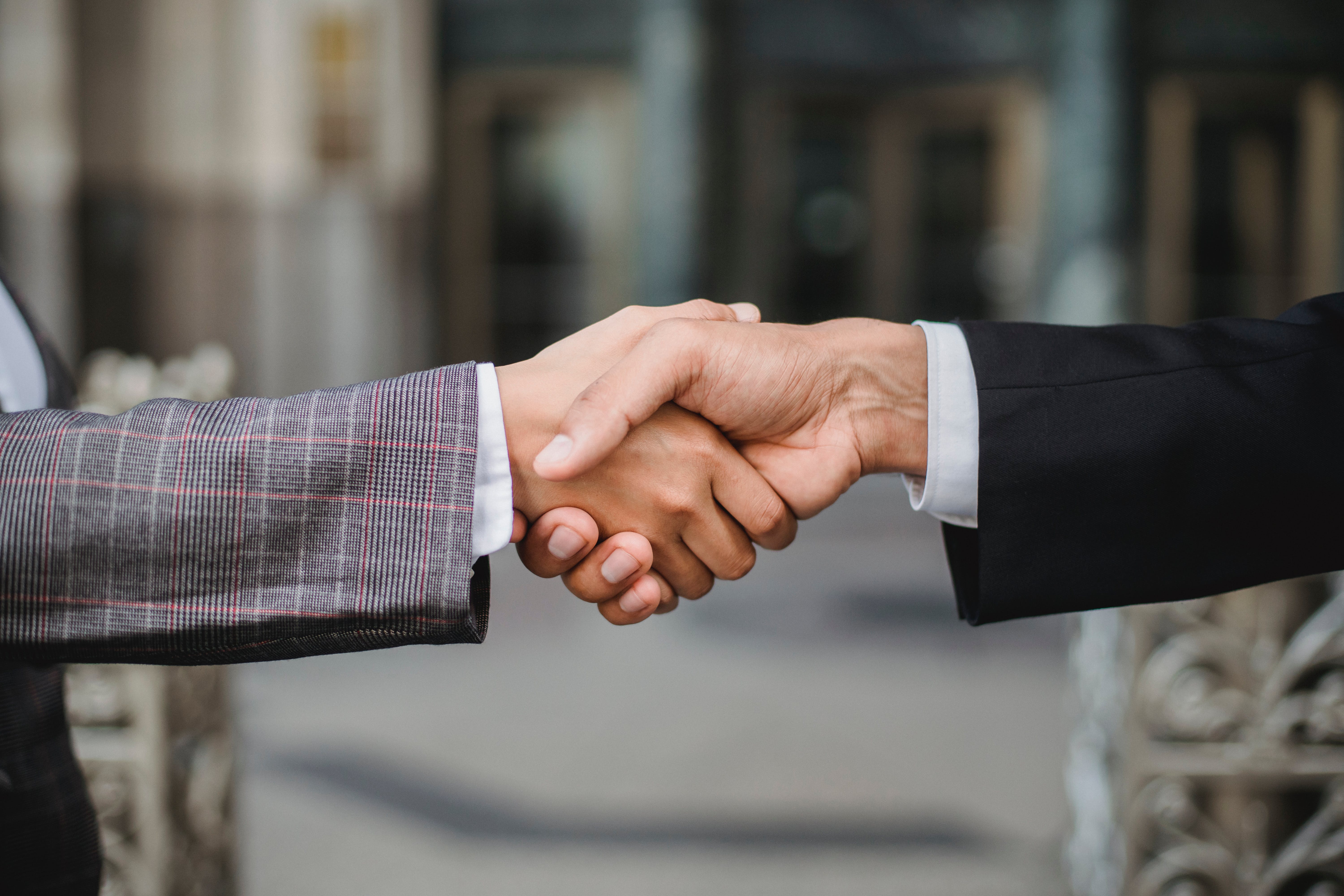 two people are handshaking